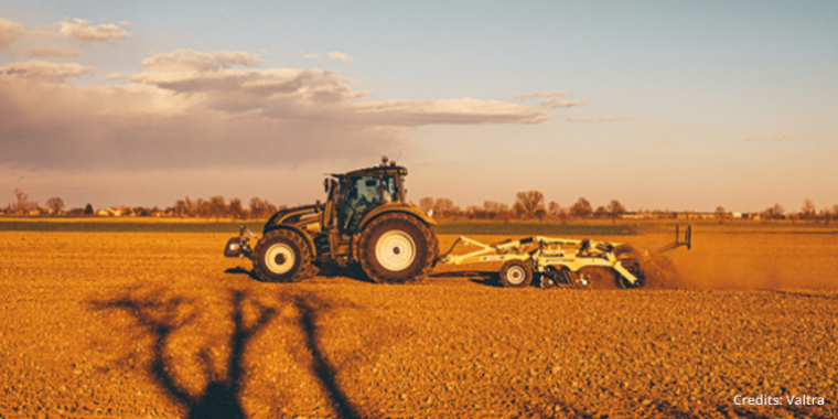 Tractor performing agriculture tasks