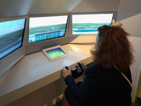 Visitors to the exhibition can try landing a plane in an A350 EGNOS simulator Visitors to the exhibition can try landing a plane in an A350 EGNOS simulator