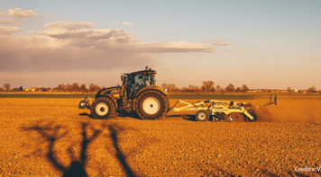 Tractor performing agriculture tasks